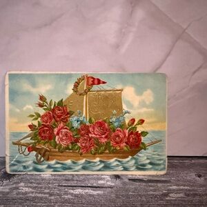 Antique 1910 postcard congratulations boat roses